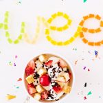 Gummy bears arranged to spell sweet in various colors