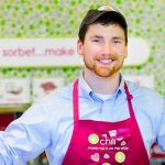 A Menchie's employee inside a store