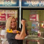 A Menchie's franchisee flexing her bicep